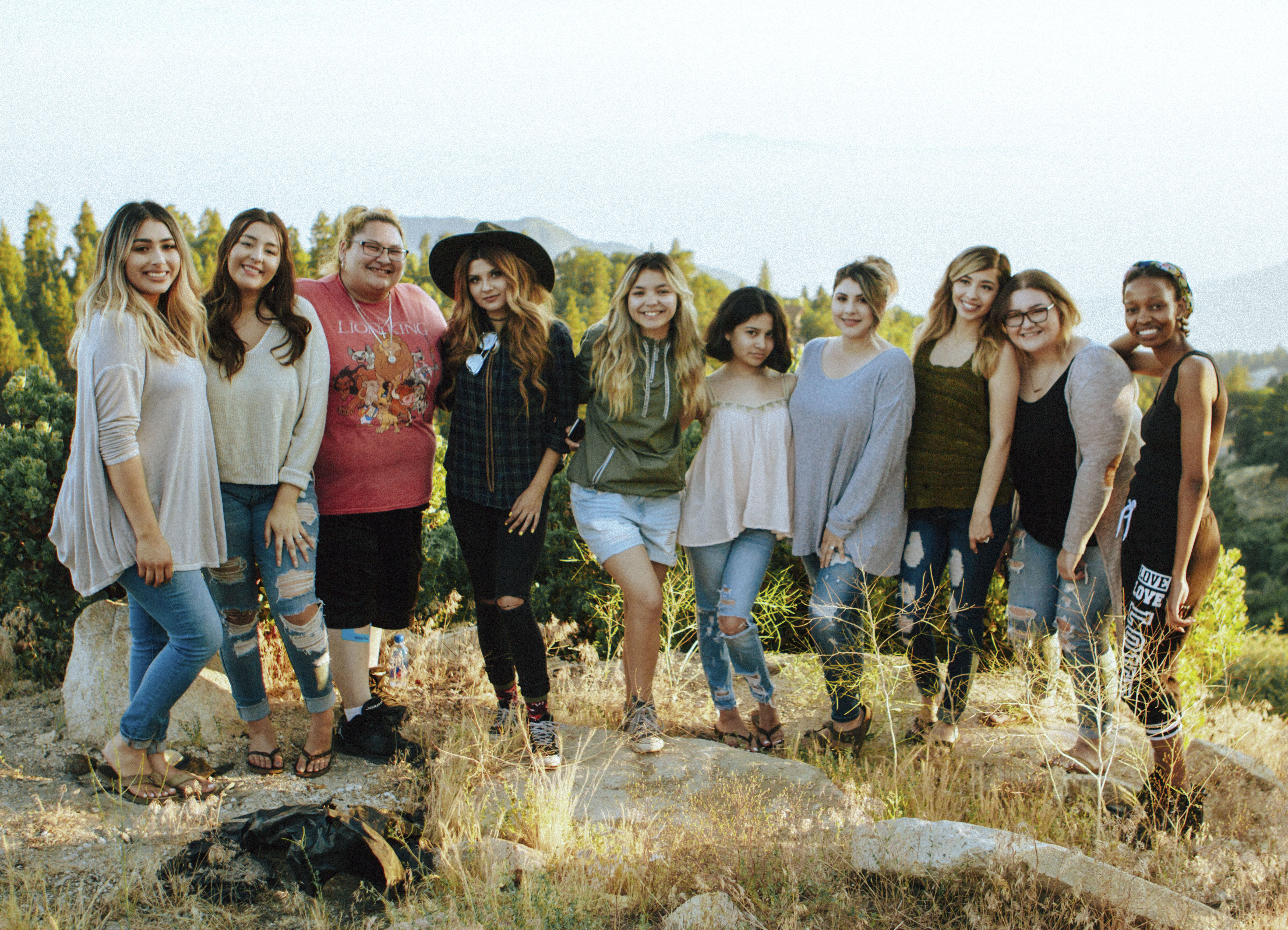 team picture of a group of ladies smiling at a camp retreat